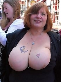 Redhead mom shows a big tits in public